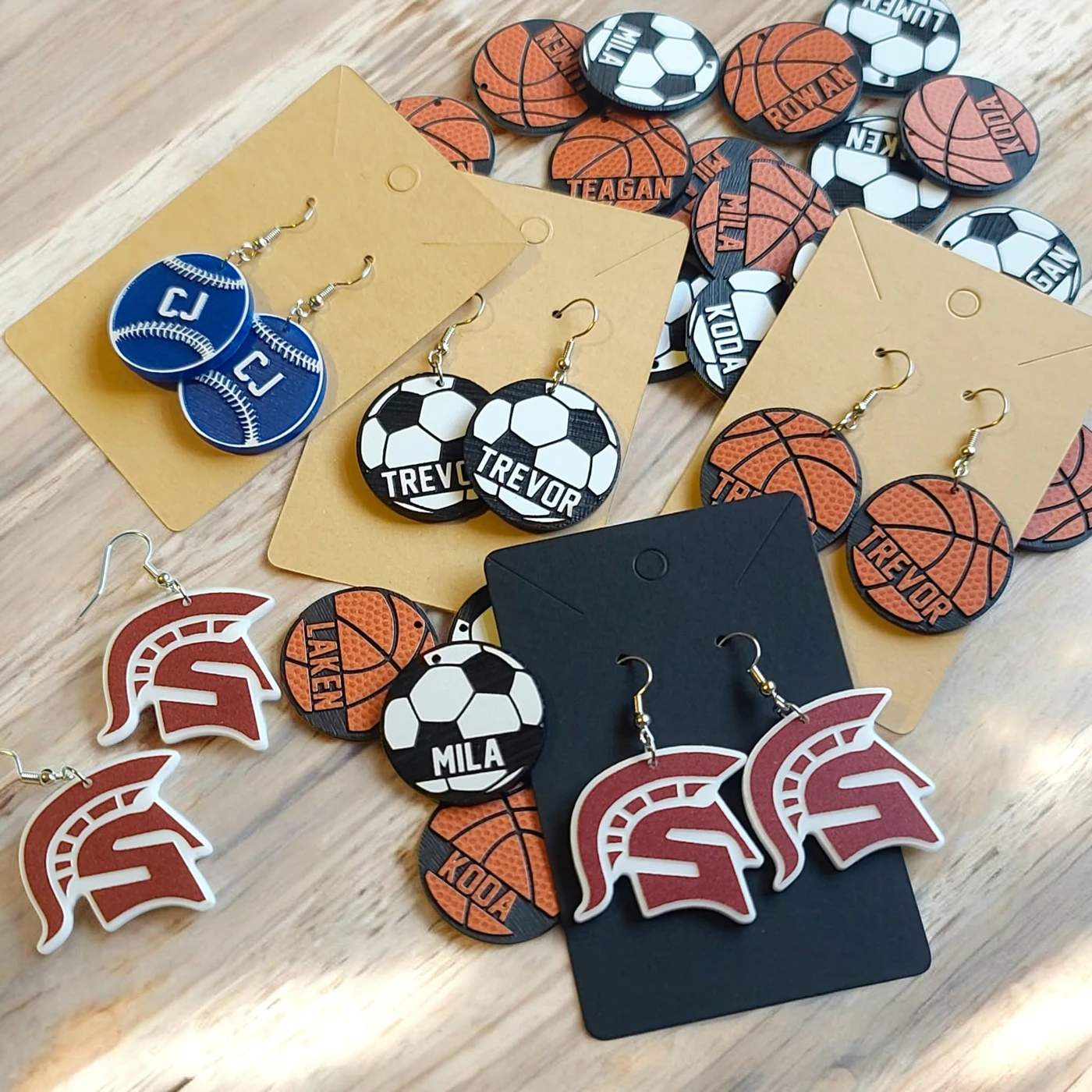Collection of personalized sports earrings and team designs
