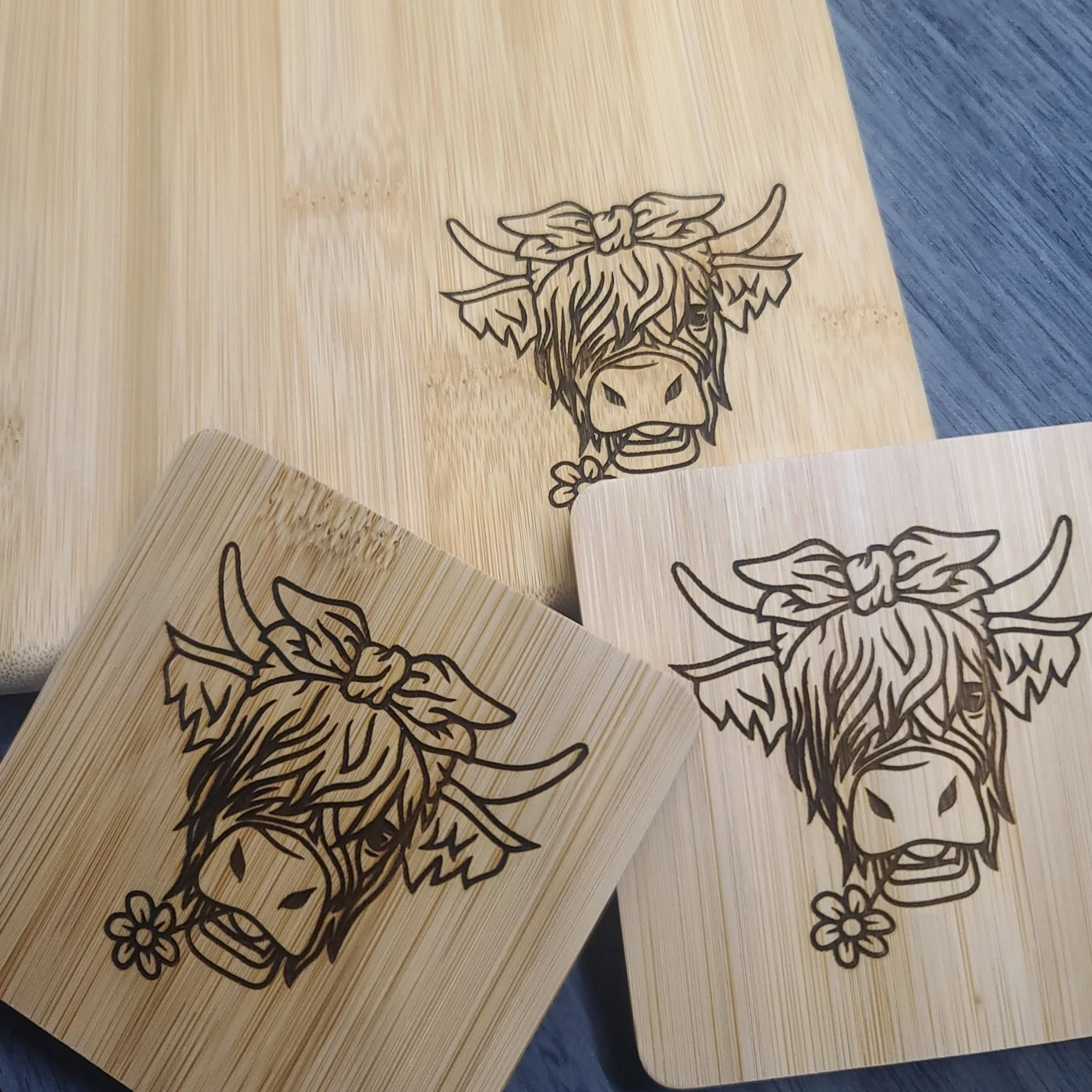 Wooden boards engraved with Highland cow designs